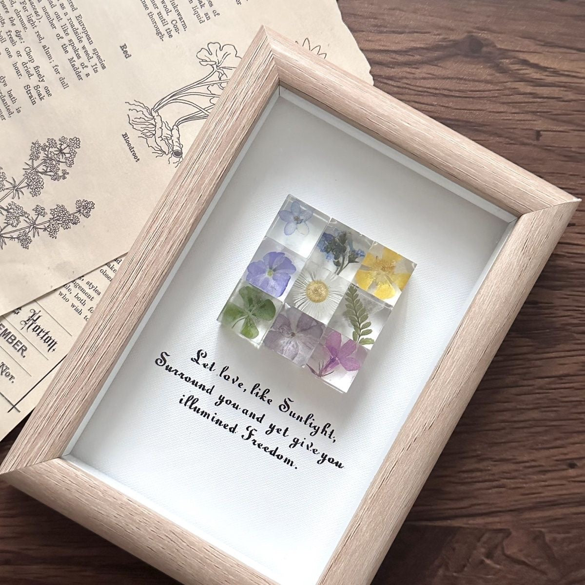 Handmade real flower frame with preserved dried blooms in wood frame.