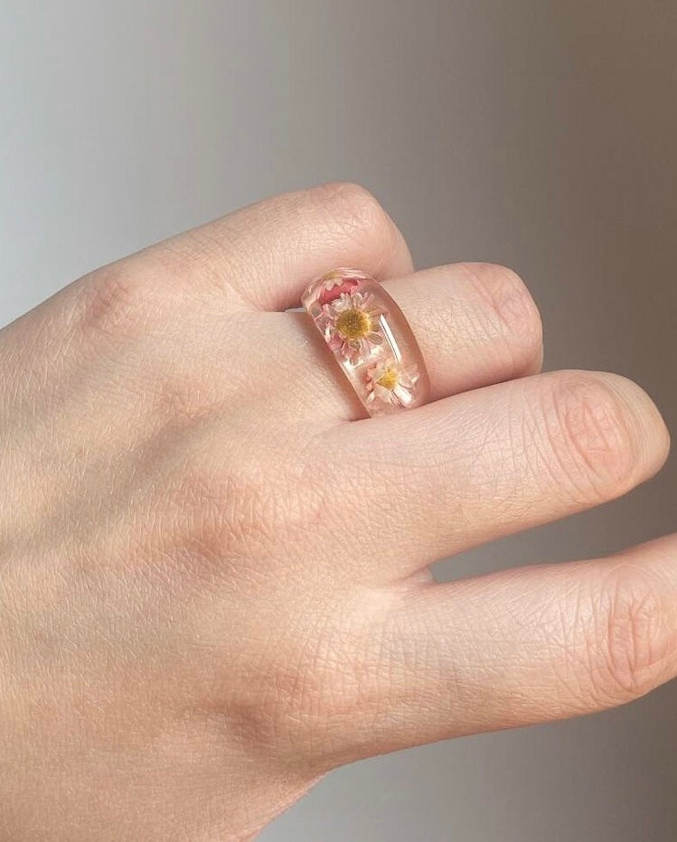 Unique floral resin jewelry ring worn on hand