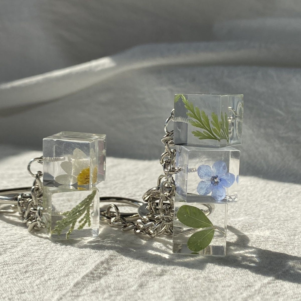 Handmade flower candy keychain with real dried blooms sealed in clear resin
